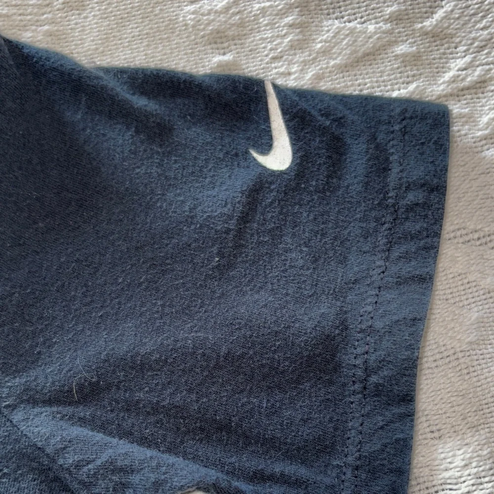 Gently loved Nike Kids Black T-Shirt with White Swoosh